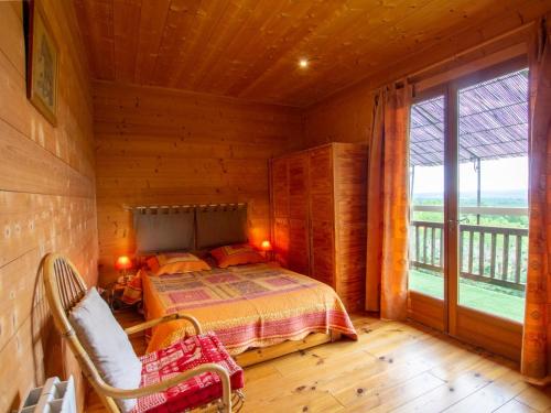a bedroom with a bed and a large window at Charmante maison avec piscine privée, climatisation, WiFi et parking - FR-1-616-166 in Montagnac-dʼAuberoche