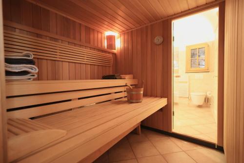 a sauna with a wooden bench in a bathroom at Casa Perinaldo in Perinaldo