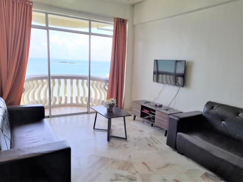 BestView Maisons Private Beach Suites Port Dicksonにあるシーティングエリア