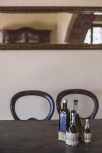 a table with three bottles on top of it at Agriturismo Tenuta Il Polardo in Piegaro