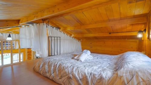 a bedroom with a bed with a teddy bear on it at Casa Los Bartolos Vélez Rubio by Ruralidays in Vélez Rubio