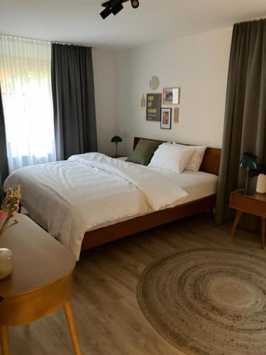 a bedroom with a large bed and a window at pop-up stuub feldberg in Feldberg