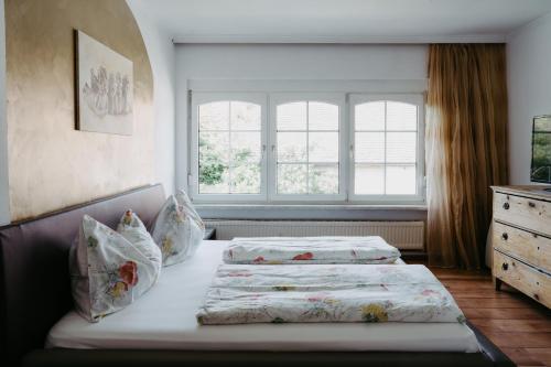 a bedroom with two beds and a window at Ferienhaus Ricki in Rust