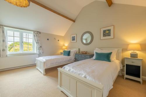 Voodi või voodid majutusasutuse Pine Cottage toas