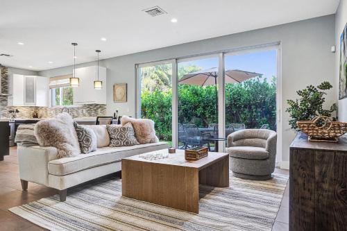 a living room with a couch and a table at Victoria Park Overlook in Fort Lauderdale