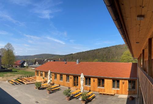a building with a lot of benches in front of it at Bike Lodge Spessart in Lohr
