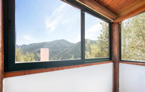 a window in a room with a view of mountains at Magia dell'Aspromonte in Ciminà