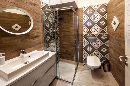 a bathroom with a sink and a shower at Dohány Street Delight in Budapest