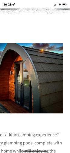 a building with an arched doorway and a building with a door at Marina Bay Pods in Aberdeen
