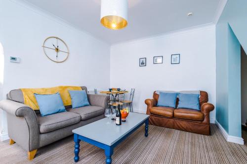 a living room with two couches and a coffee table at Talbot House in Chester