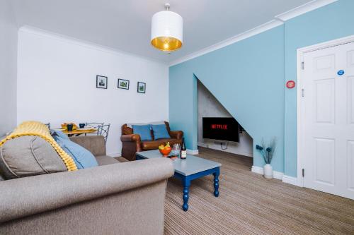 a living room with a couch and a table at Talbot House in Chester