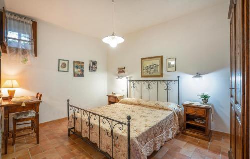 a bedroom with a bed and a table and a lamp at Apt, Apecchio in Apecchio