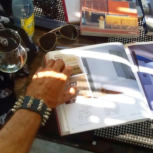a person is typing on a laptop on a desk at Cytyz Appart Hôtel in Mahajanga