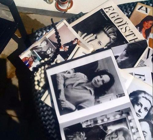 a bunch of pictures and photographs on a table at Cytyz Appart Hôtel in Mahajanga