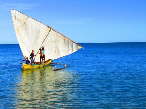a group of people on a small sail boat in the water at Cytyz Appart Hôtel in Mahajanga