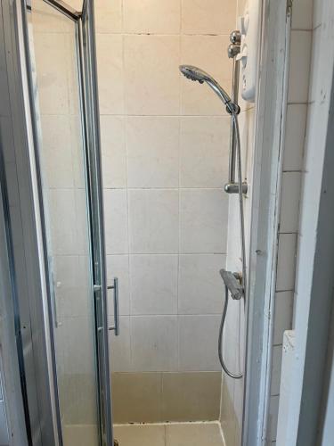 a shower stall with a glass door with a shower at 20 East Tenter Street in London