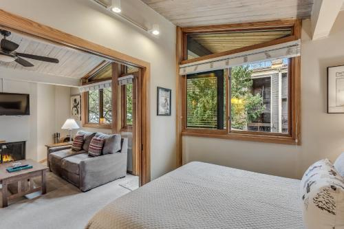 a bedroom with a bed and a couch at Laurelwood Condominiums 412 in Snowmass Village
