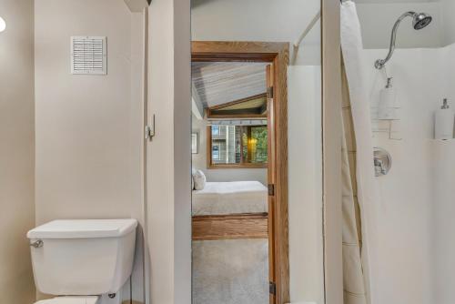 a small bathroom with a toilet and a shower at Laurelwood Condominiums 412 in Snowmass Village