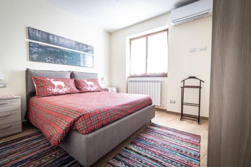 Postel nebo postele na pokoji v ubytování La Casa sul Fiume