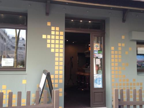 a building with yellow squares on the side of it at L'HÔTEL de CHARTRES in Chartres
