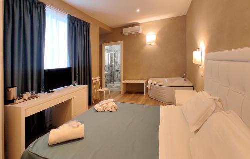 Ένα ή περισσότερα κρεβάτια σε δωμάτιο στο Hotel Cecina Beach
