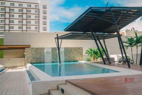 a swimming pool on the roof of a building at Centrio Tower w/ Netflix + WiFi in Cagayan de Oro