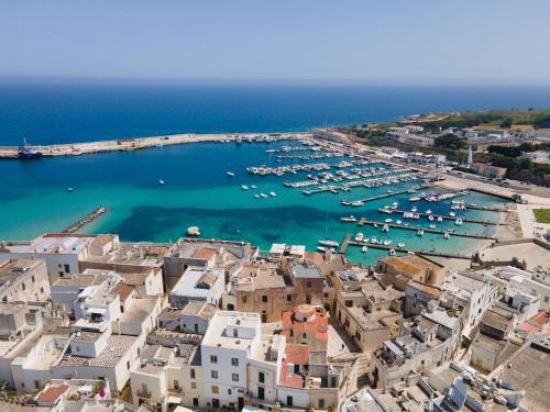 an aerial view of a harbor with boats in the water at Casa Maricla - Marea Collection in Otranto