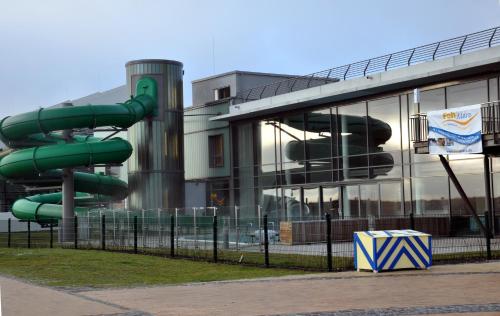 a water slide in front of a building at Burgtiefe Südstrand "Sorglos" in Fehmarn