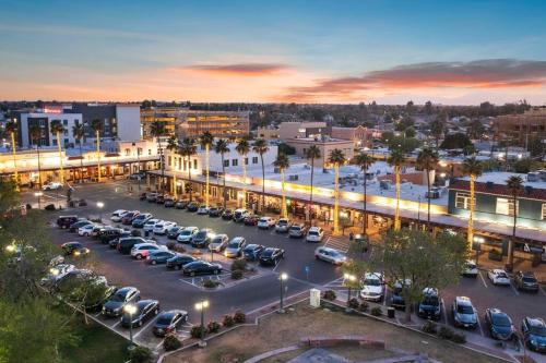 a parking lot with cars parked in a city at Pohaku Paea Studio suite.nui in Chandler