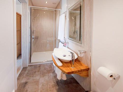 a bathroom with a sink and a shower at Dalvista Cottage in Leurbost