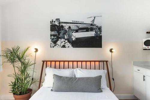 a black and white photo of a bed in a bedroom at Molokoni Studio suite liʻiliʻi in Chandler