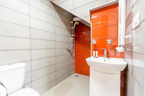 a bathroom with a toilet and a sink at Borjomi Nest 1 in Borjomi