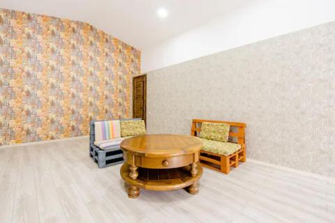 a room with a table and two chairs in it at Borjomi Nest 1 in Borjomi