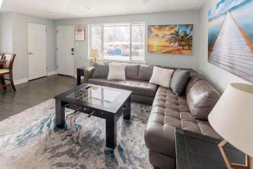 a living room with a couch and a coffee table at Golfers Dream! Sweet NW location. in Arvada