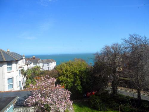 a view of the ocean from a house at Medehamstede Hotel in Shanklin