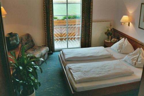 Ένα ή περισσότερα κρεβάτια σε δωμάτιο στο Radhotel Schischek