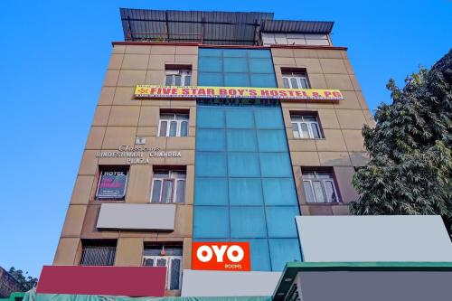 a tall building with a sign on it at Flagship Hotel The Pinkcity in Patna