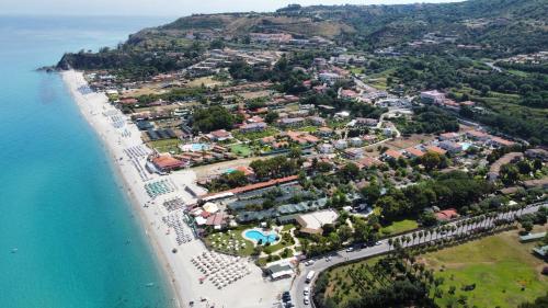 an aerial view of a resort and the beach at Hotel La Giara in Zambrone