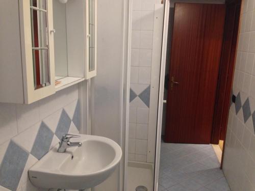 a bathroom with a sink and a shower at Albergo Etrusco in Calusco dʼAdda