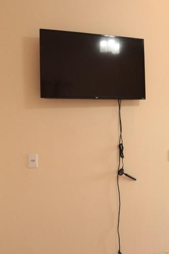 Μια τηλεόραση ή/και κέντρο ψυχαγωγίας στο Casa c WiFi e otima localizacao em Barreirinhas MA