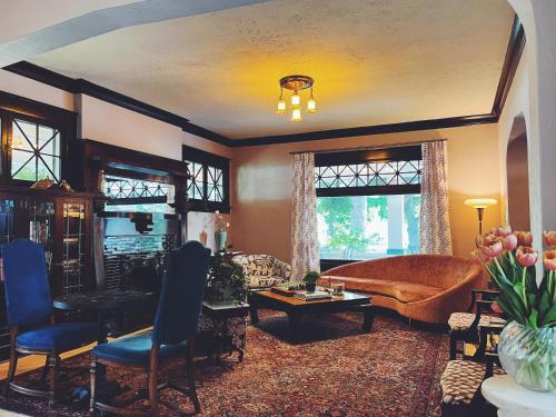 a living room with a couch and a table at Marianna Stoltz House in Spokane
