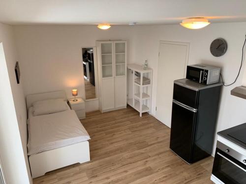 Η κουζίνα ή μικρή κουζίνα στο Frundsberg-Apartment