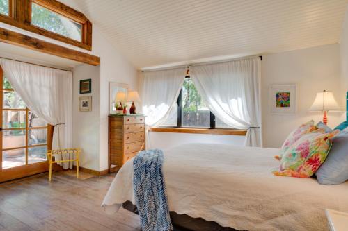 a bedroom with a large bed and a window at Patagonia Cottage with Patio and Yard Walk to Town! in Patagonia