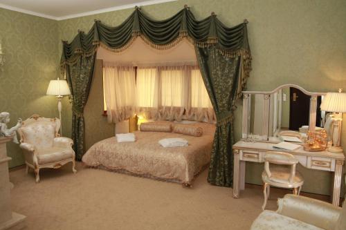 Posteľ alebo postele v izbe v ubytovaní Citadel Hotel