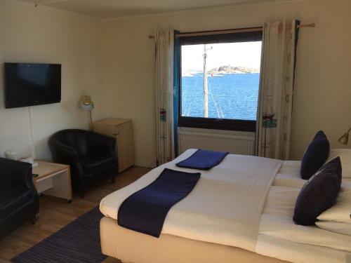 Postel nebo postele na pokoji v ubytování Hotell Fisketången
