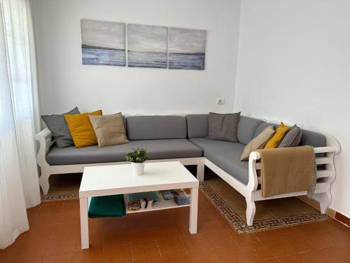 a living room with a couch and a table at Casa Peña en Son Bou in Son Bou