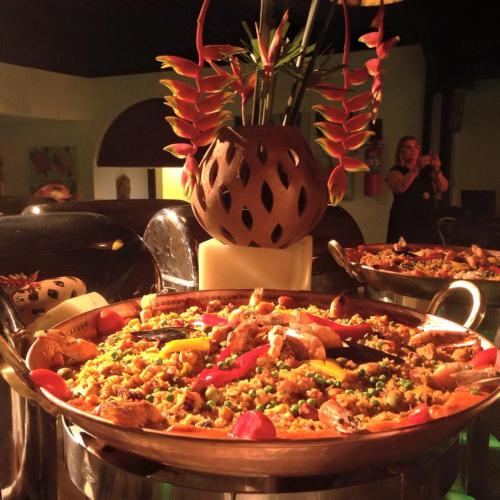 a pizza in a pan on a table at Serrambi Resort in Porto De Galinhas