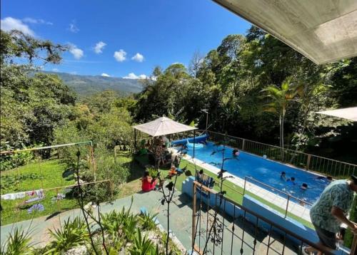 a view of a swimming pool at a resort at Quinta privada con cabaña y piscina temperada in Cartago