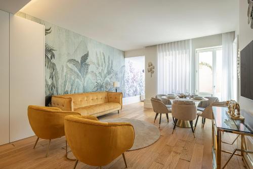 a living room with a couch and a table at The Downtown Charming Apartments in Porto