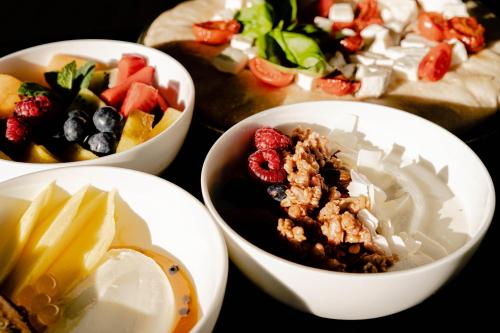 a group of bowls of food with fruit in them at Tobago in Garda